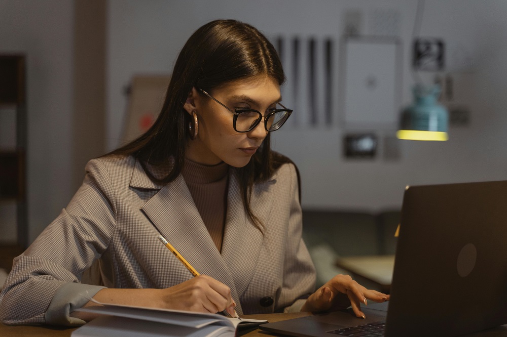 https://www.pexels.com/photo/woman-in-gray-blazer-using-laptop-computer-5685937/